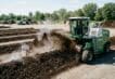 Commercial compost turner aerating a windrow at an Australian composting site